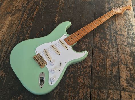 fender mint green electric guitar